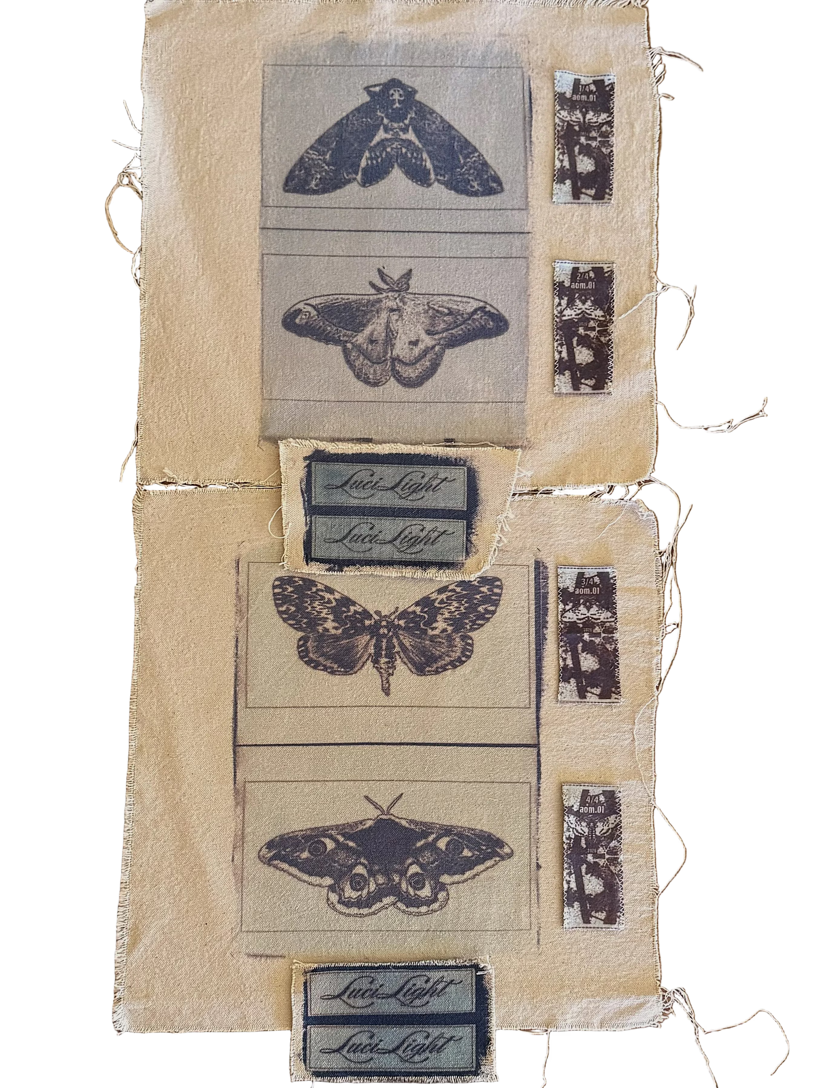 A textile sample or fabric panel laid flat on a wooden surface, featuring cyanotyoe moth and butterfly illustrations, small vertical inset prints, and repeated 'LuciLight' labels on a beige woven background.